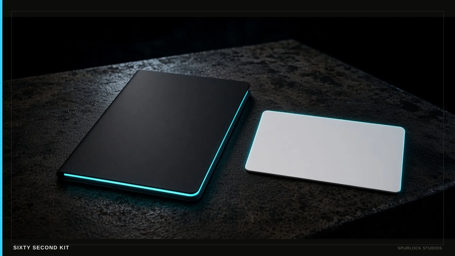 A slim media-kit folder and a contact card on black steel.